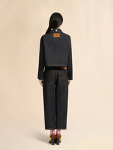 Black denim jacket with daisy appliqués